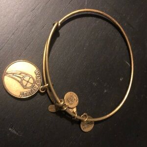 Gold Alex and Ani retired bracelet, Wolf Spirit.
